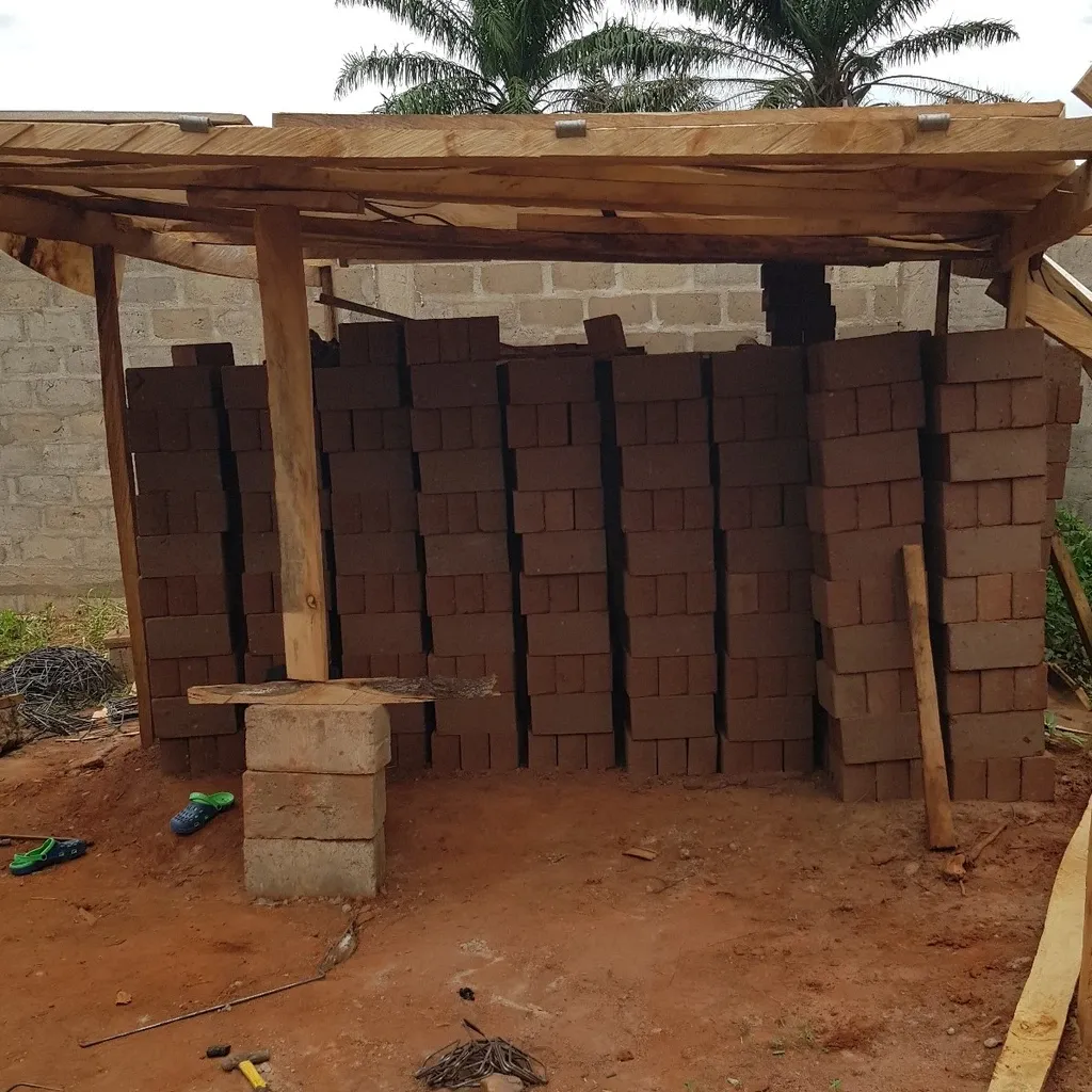 In the middle, the brick makers: with a special press they make bricks from red clay and a little cement that give a very