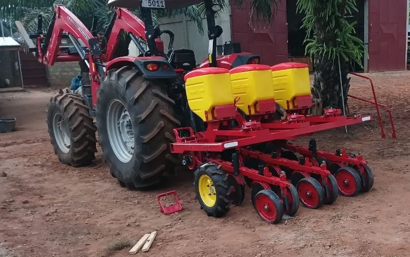 The machine half assembled: at the front are the hoppers for placing fertiliser under the seed, the seed hoppers follow at