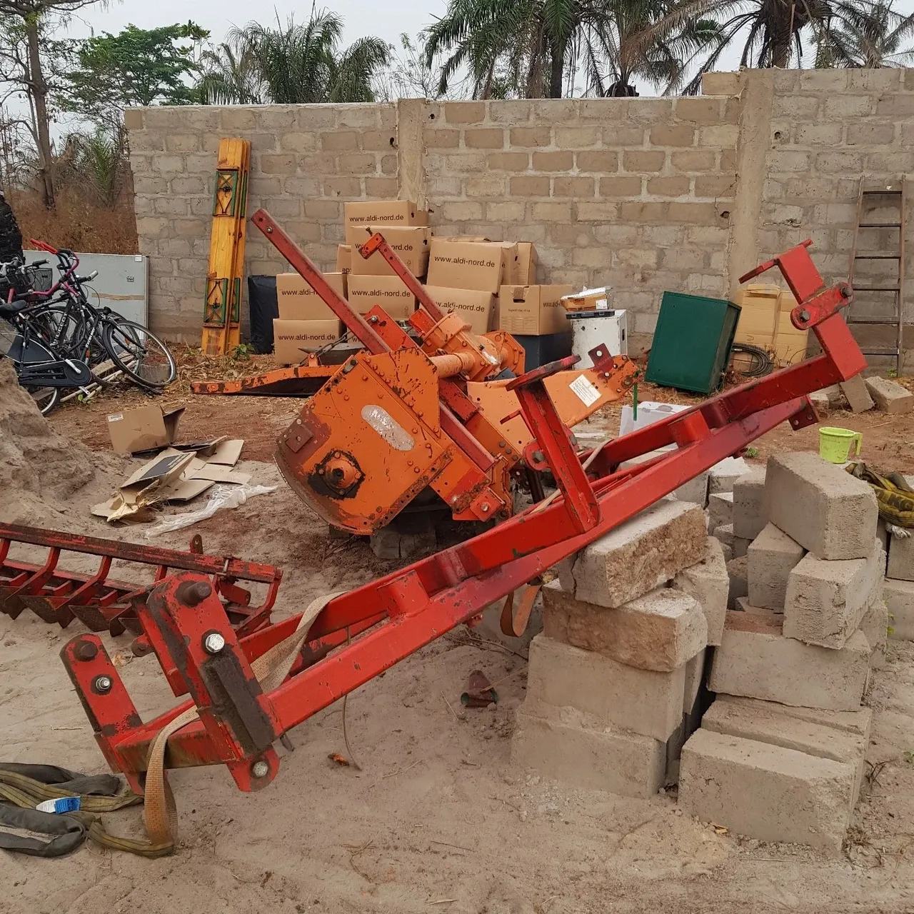 More equipment: the rotary tiller, the hoe and the generator were unloaded at night by a truck with a small crane