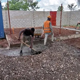 All the concrete has to be mixed by hand, a concrete mixer would make things much easier